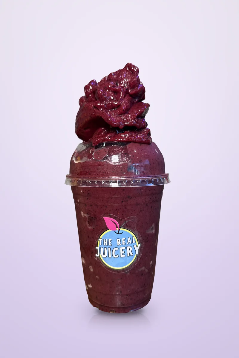 Açai Sunrise smoothie, filled over the top of the cup